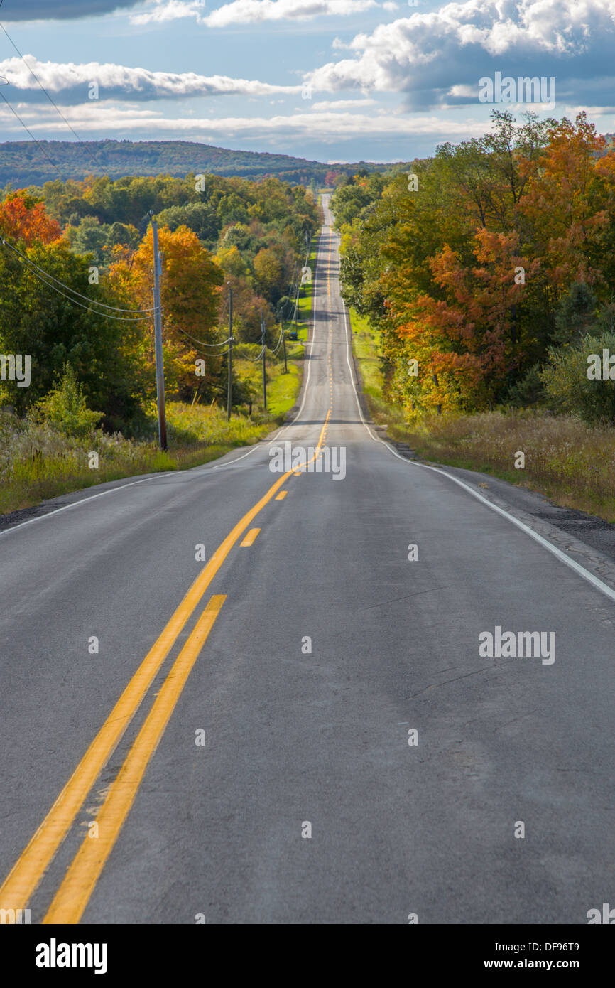 Road in Finger Lakes area of New York State with fall colors Stock Photo