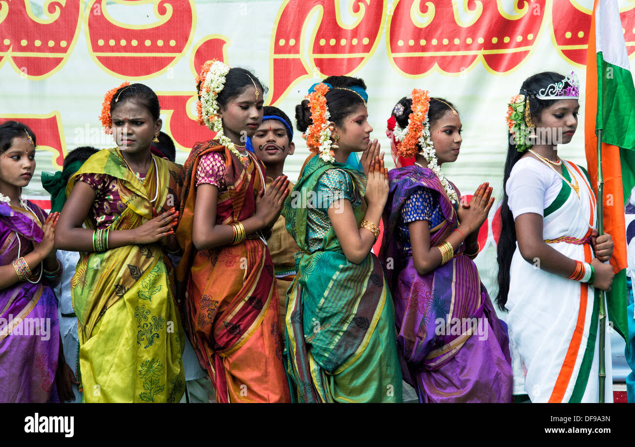 Indian girls dressed in traditional costumes dancing at a protest rally. Puttaparthi, Andhra Pradesh, India Stock Photo