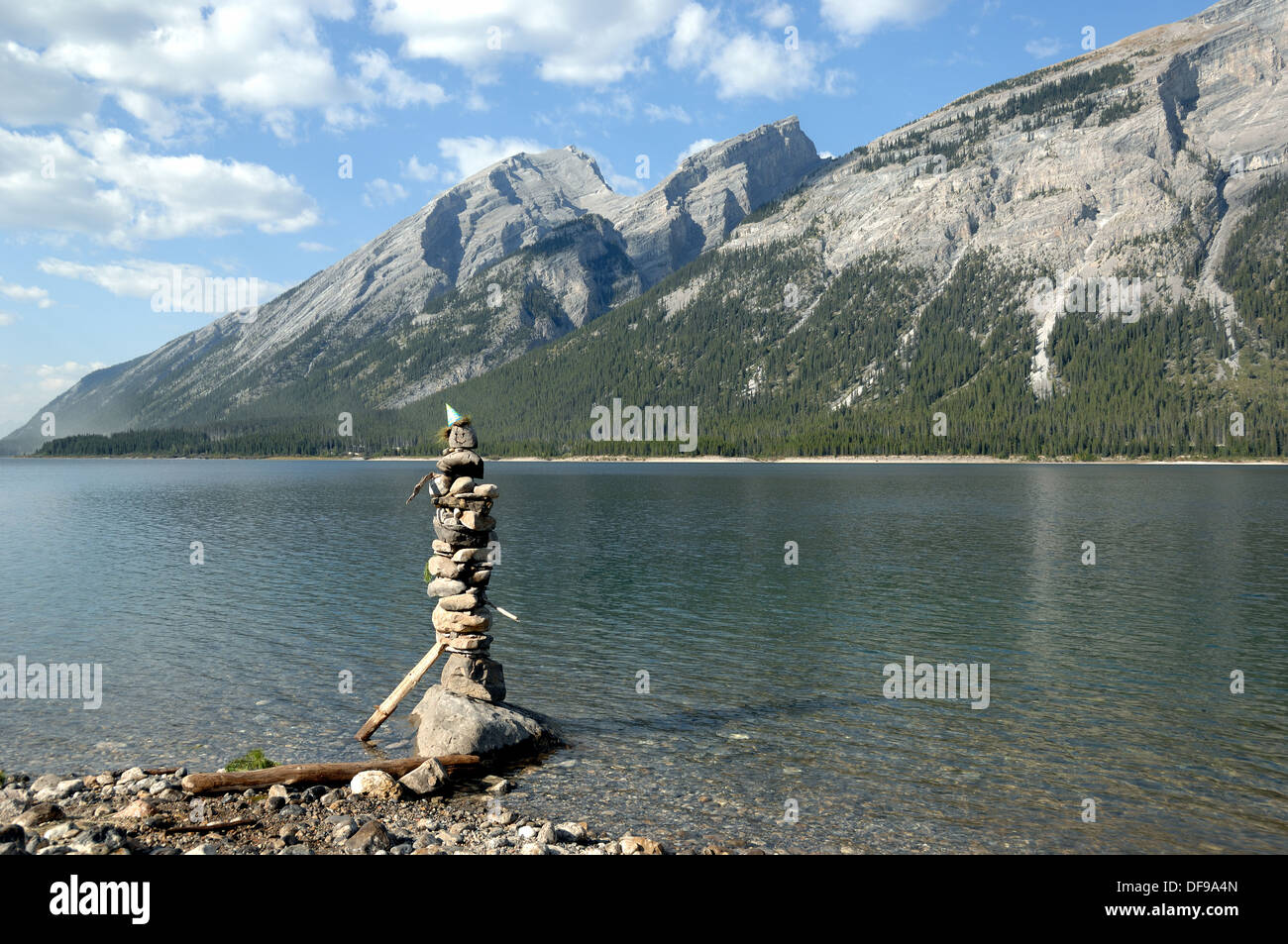 A rock pile with a party hat on top at Spray Lakes near Canmore, Alberta, Canada Stock Photo