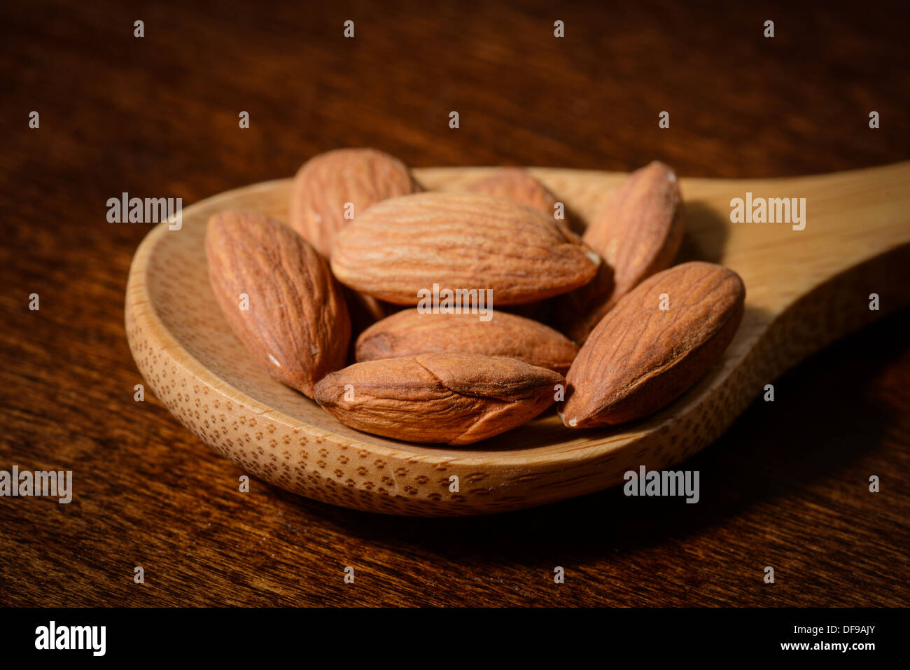 Almonds in a Spoon Close Up Stock Photo
