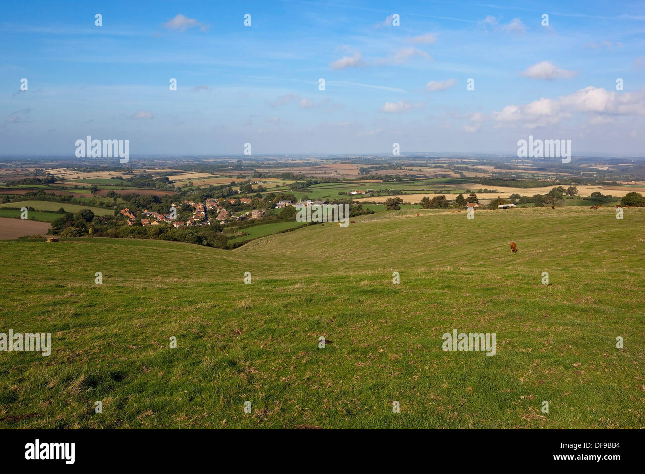 English landscape with Acklam village and the distant vale of York  viewed from a meadow high on the Yorkshire wolds. Stock Photo