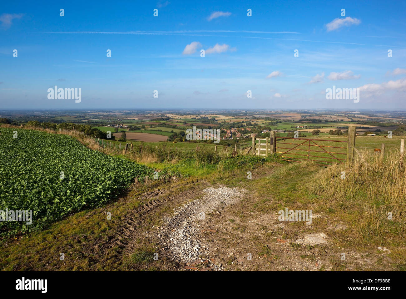 English landscape with a view of Acklam village from agricultural fields high on the Yorkshire wolds under a blue sky Stock Photo