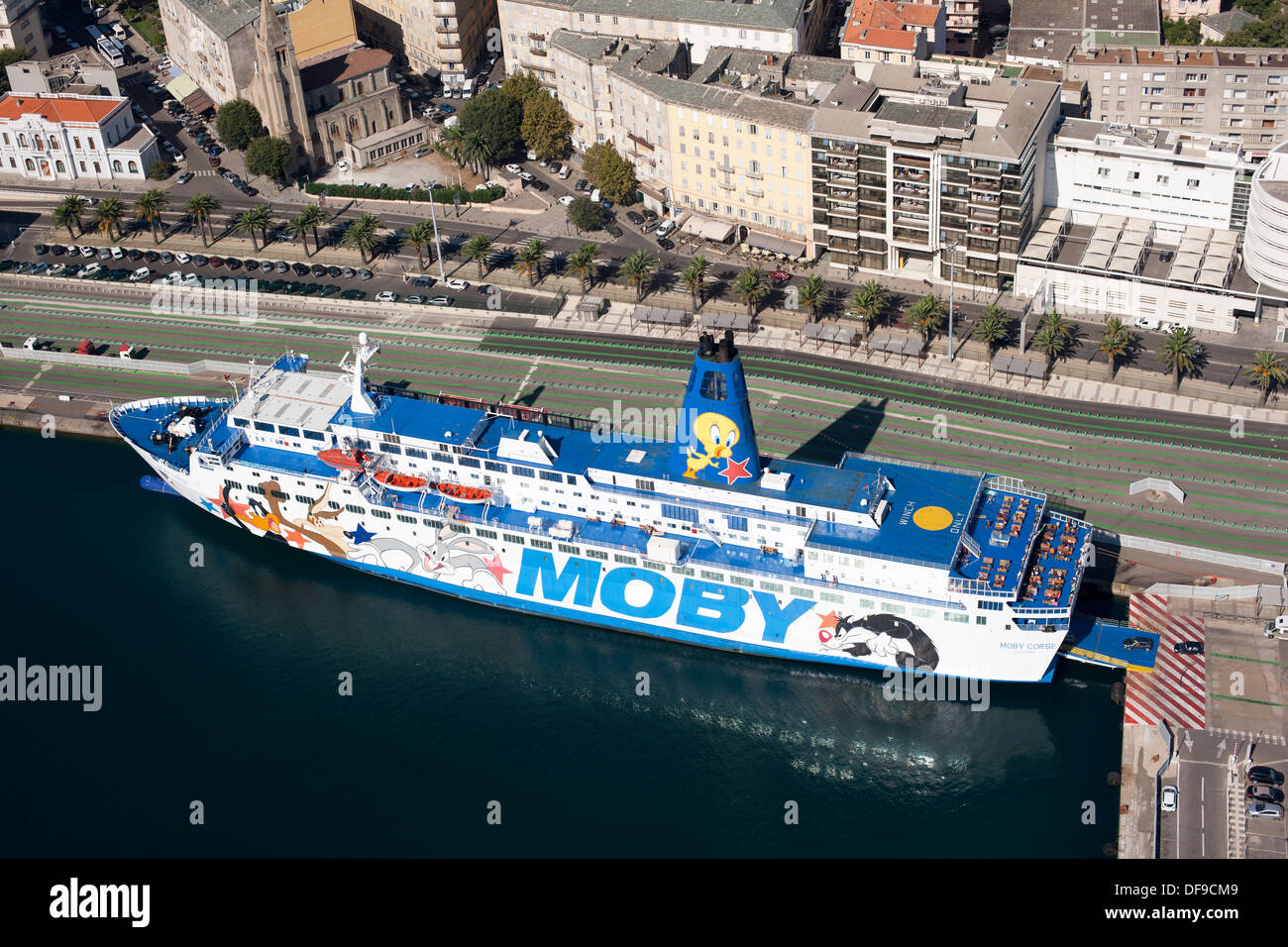 AERIAL VIEW. Vehicles embarking on a ferryboat in Saint-Nicolas Port. Bastia, Corsica, France. Stock Photo