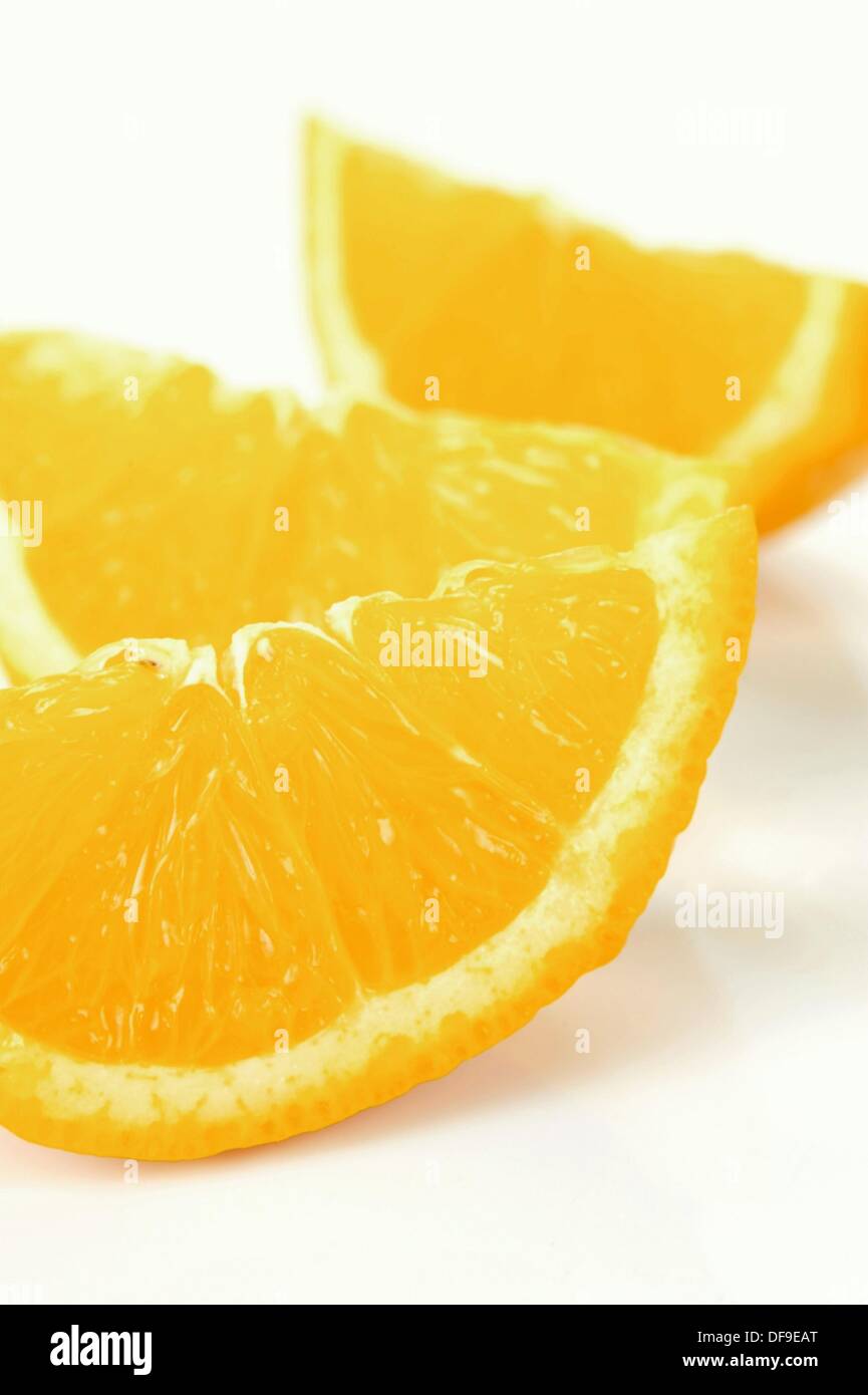 Orange quarters isolated against a white background Stock Photo Alamy