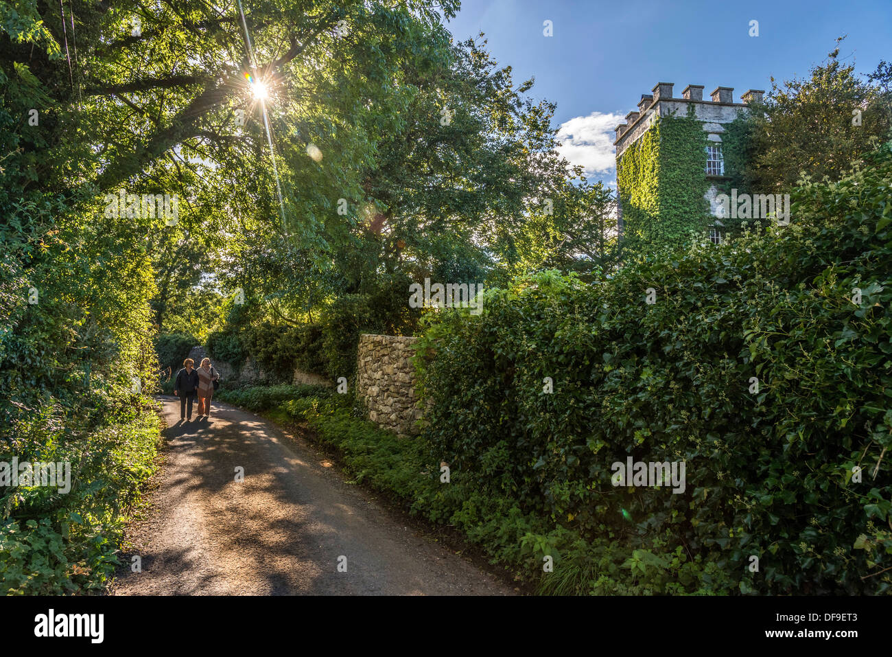 A leafy lane at Silverdale passes the Lindeth Tower in the garden of Gibraltar Farm at Jenny Brown's Point. Stock Photo