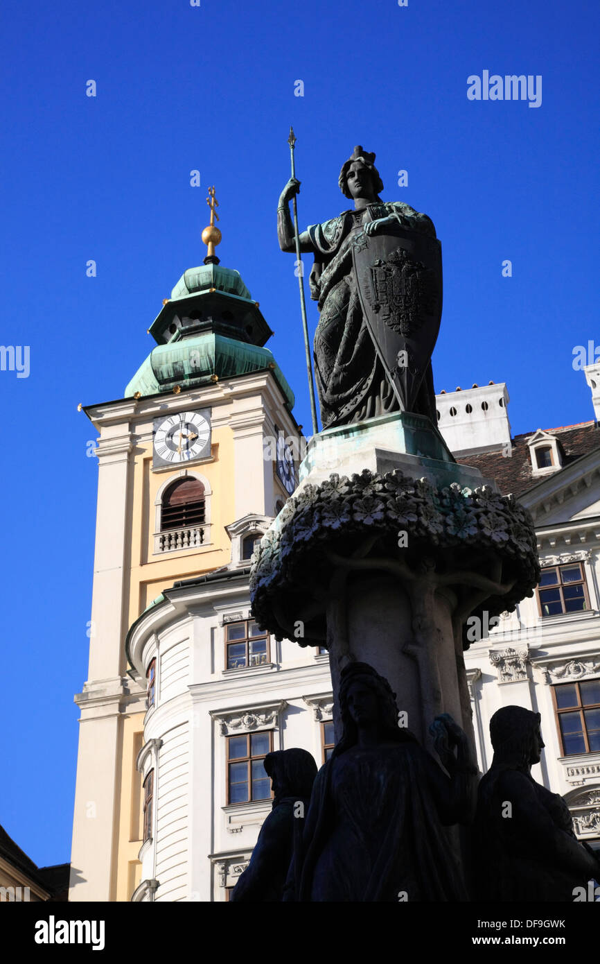 Austria-Fountain at  Freyung with tower of Schottenkirche, Vienna, Austria, Europe Stock Photo