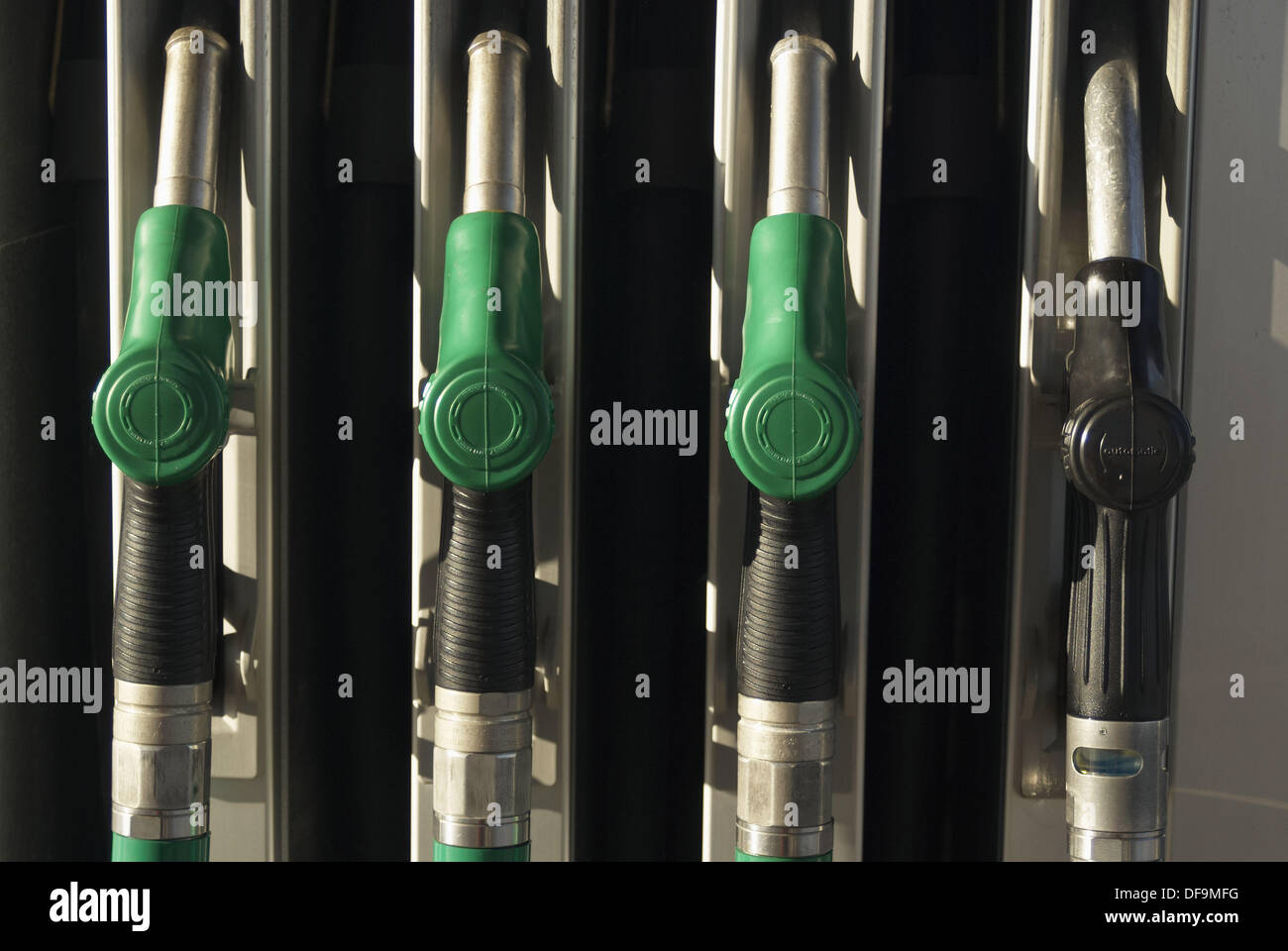 Gas pump handles at gas station in Denmark Stock Photo Alamy