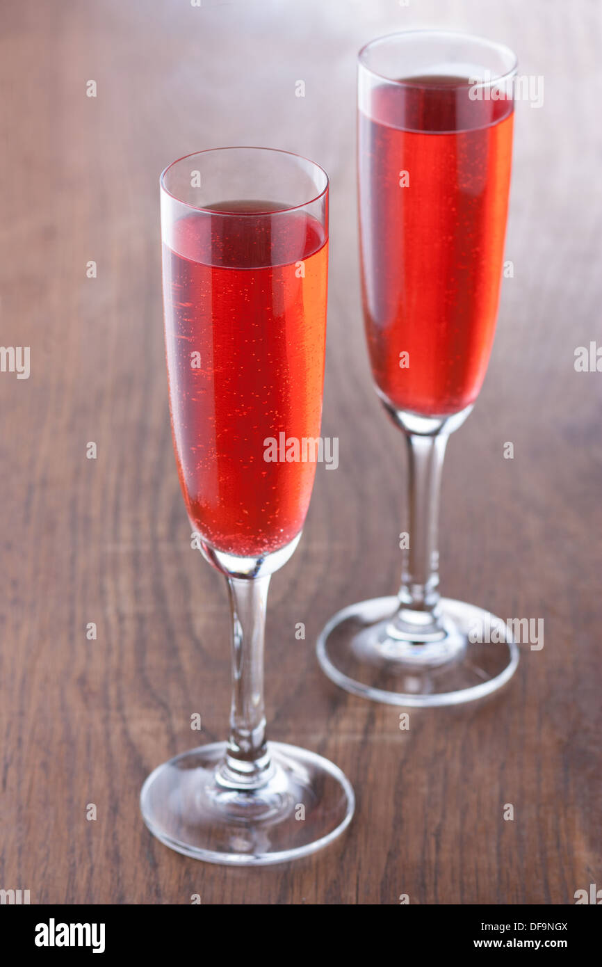 Kir royale cocktail prepared in the traditional way on wooden table Stock Photo