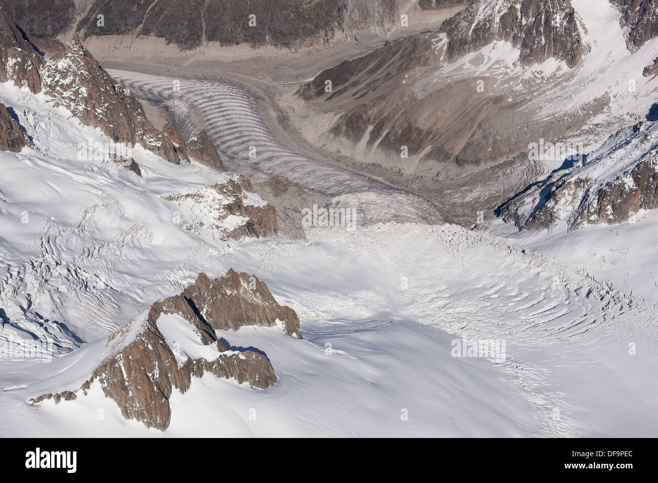 AERIAL VIEW. Tacul and Mer de Glace glaciers. Forbes bands (ogives) visible on the Mer de Glace glacier. Chamonix Mont-Blanc, Haute-Savoie, France. Stock Photo