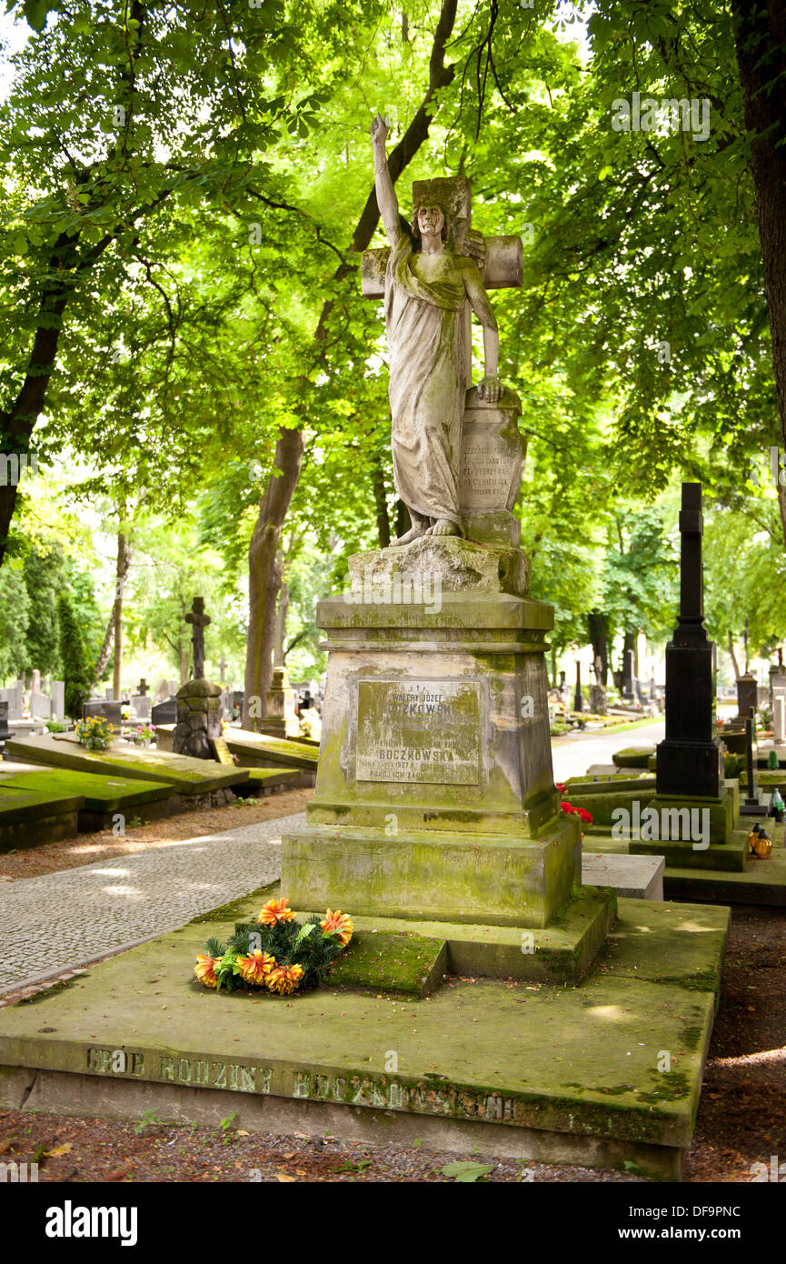 grave of angel crying with blood on cemetery Stock Photo