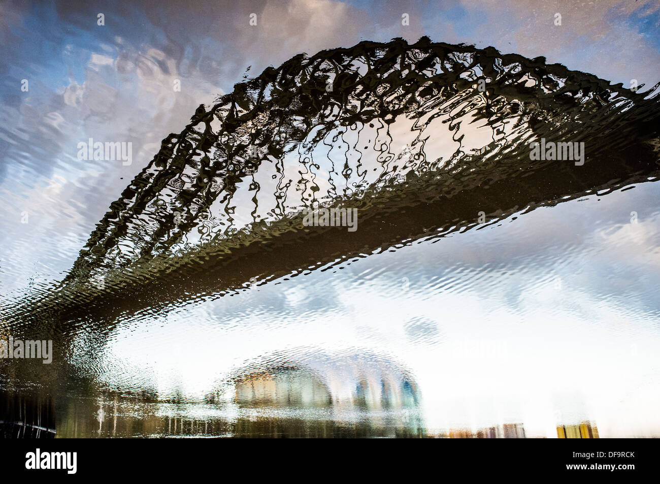A reflection of the Tyne Bridge and the Sage Centre in the water of the River Tyne. Newcastle upon Tyne, England. Stock Photo