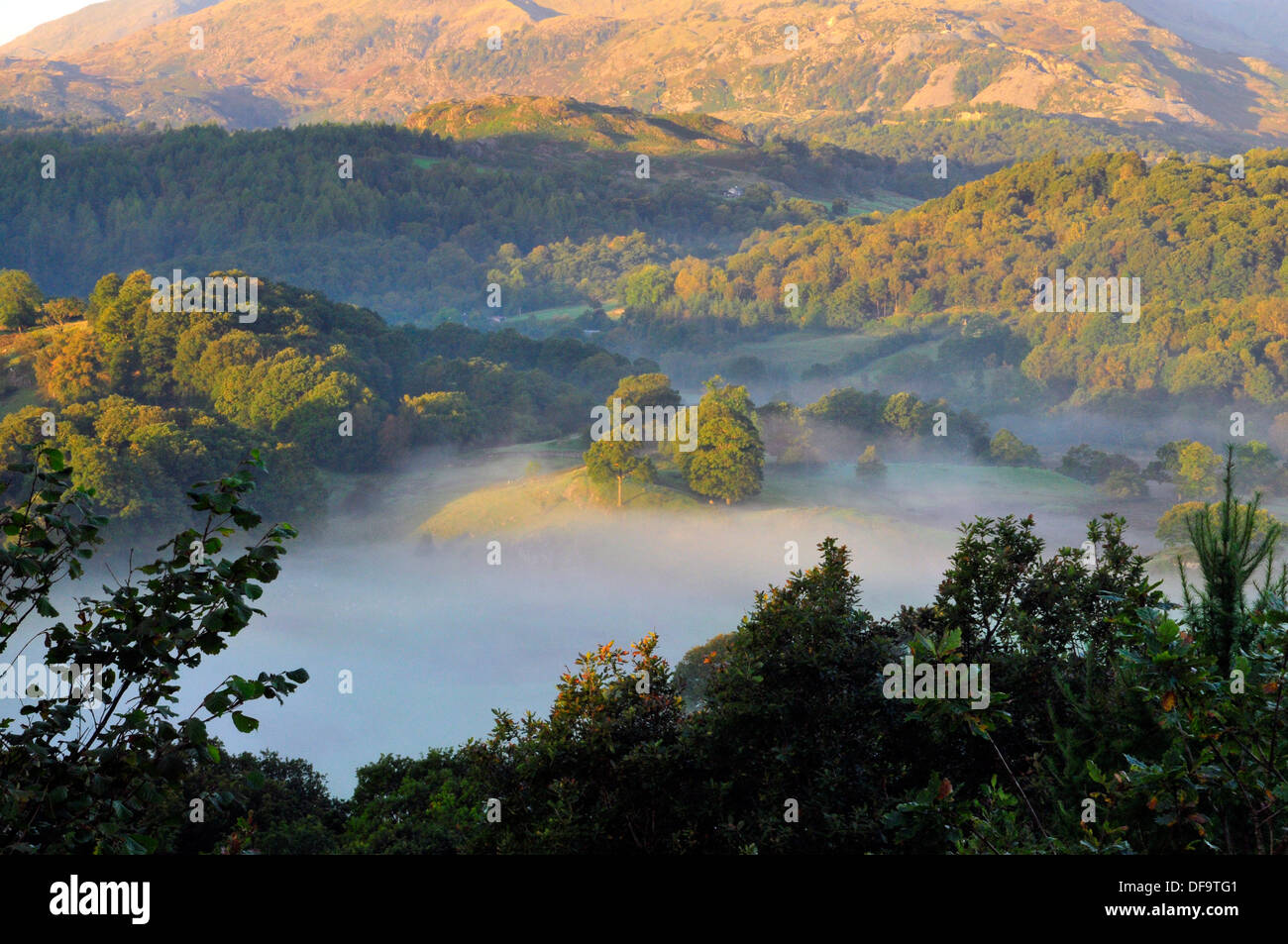 Early Morning Mist Across The Valley Stock Photo - Alamy