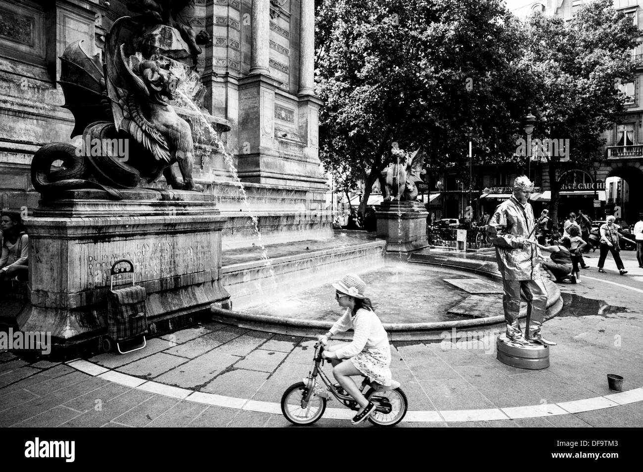 Tourists and a Street Entertainer at Fountain St Michel in Paris, France. Stock Photo