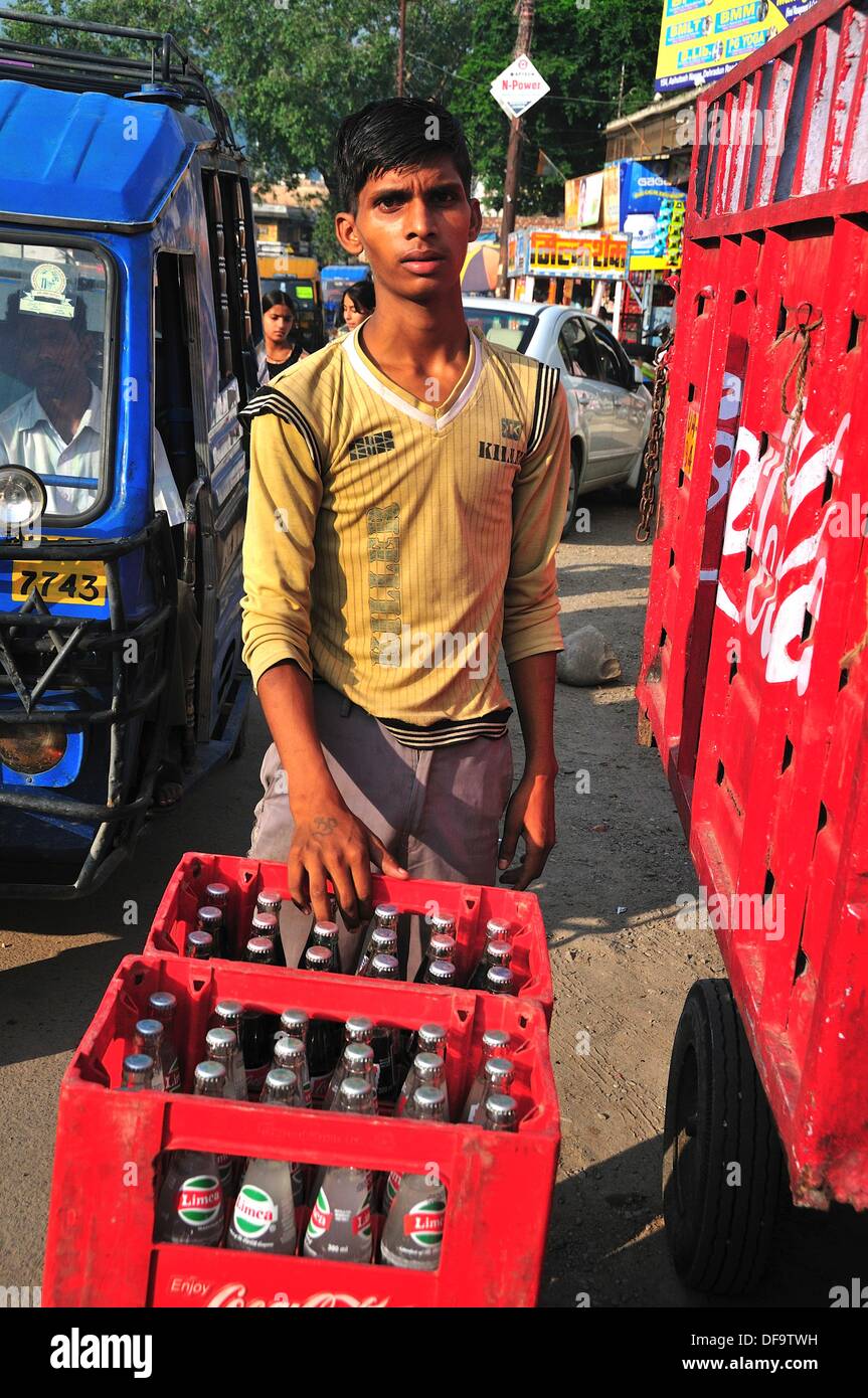 Young man deliver cold drinks to the shop Stock Photo Alamy