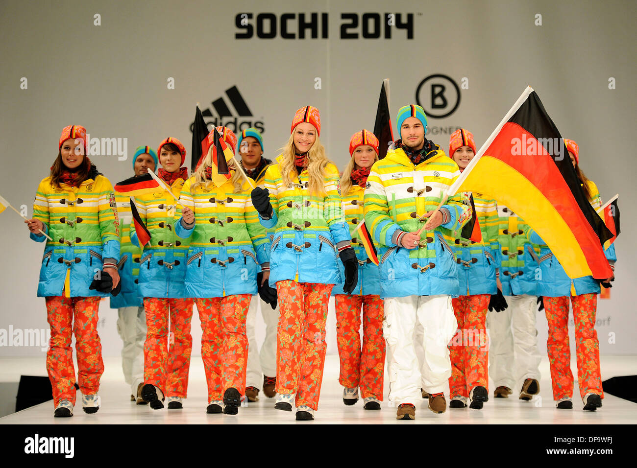 Duesseldorf, Germany. 01st Oct, 2013. Led by freeskier Benedikt Mayr (FRONT-R) and speed skater Monique Angermueller (FRONT-L), athletes present the new collection for the German Olympic and Paralympic team in Duesseldorf, Germany, 01 October 2013. The German Olympic Sports Confederation (DOSB) presented the official costume of the German team for the 2014 Winter Olympics in Sochi. Photo: MARIUS BECKER/dpa/Alamy Live News Stock Photo