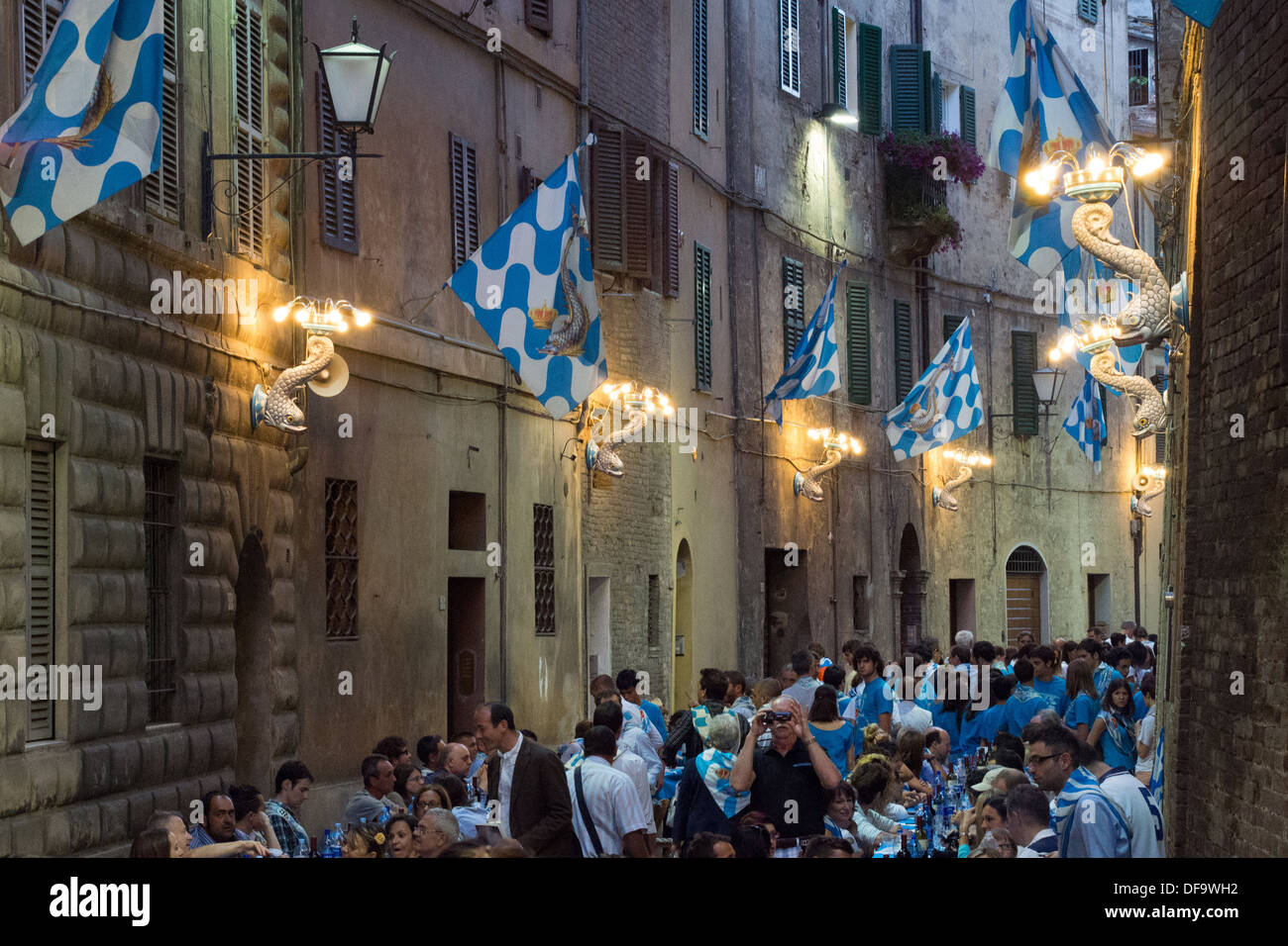 'Onda' (Wave) contrada (district) meal after the general Palio trial, the evening before the Palio itself, Siena, Tuscany, Italy Stock Photo