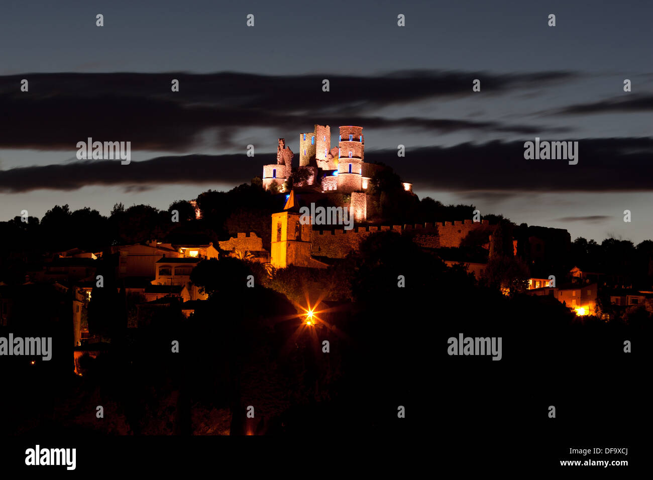 Time exposure of a perched medieval castle at dusk. Grimaud Castle, Var, French Riviera, Provence, France. Stock Photo