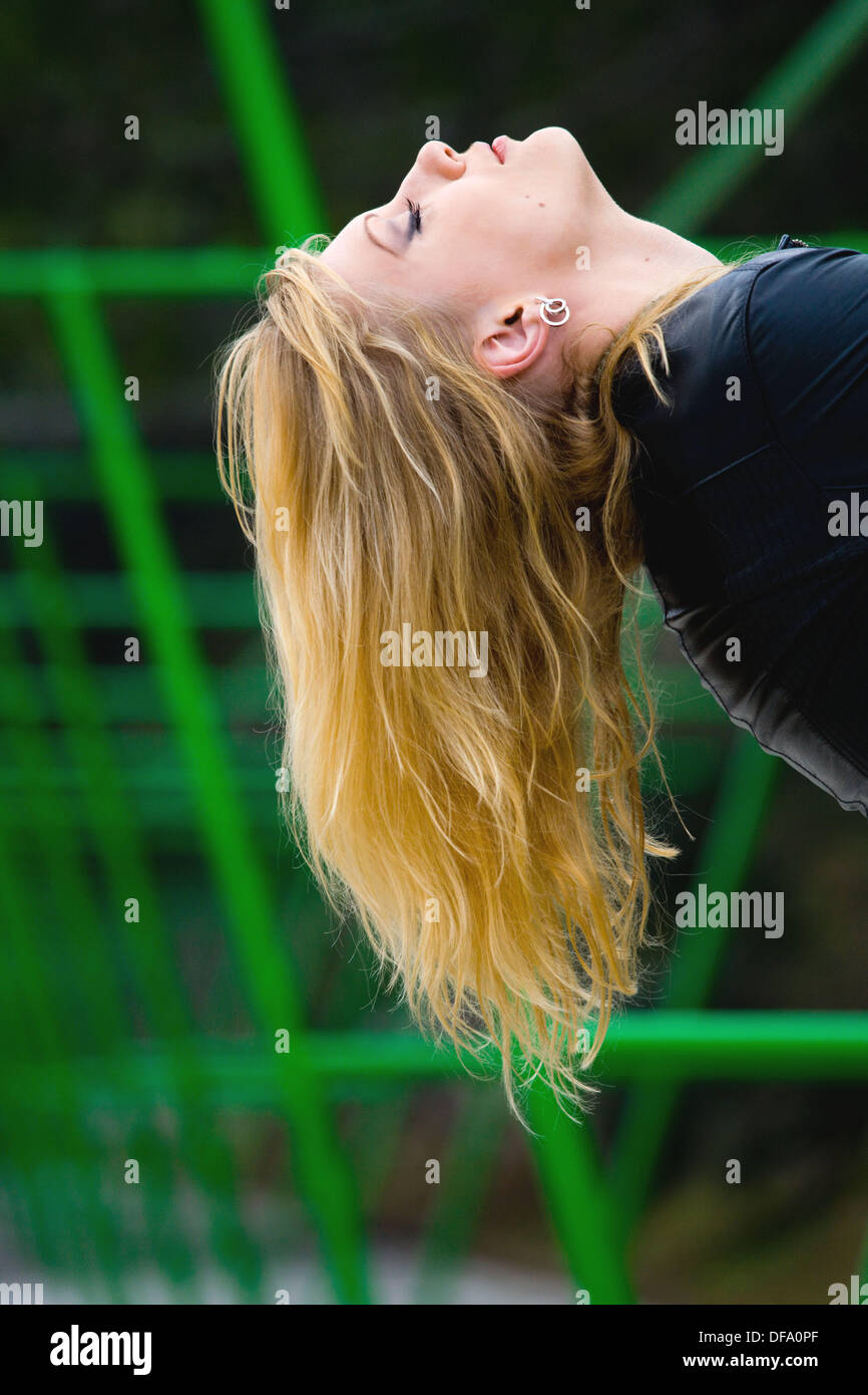 Blonde Girl Showing Her Long Hair Upside Down Stock Photo