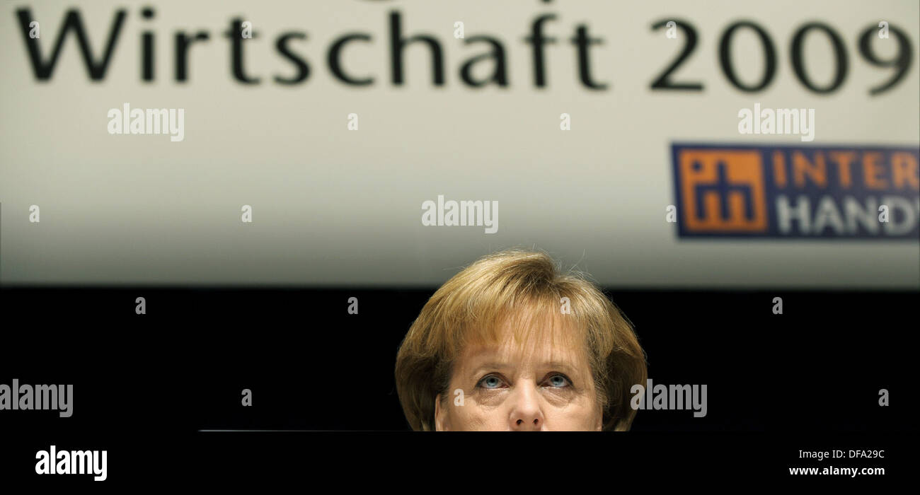 German chancellor Angela Merkel under the writing 'Economy 2009' after the talks of German trade associations in the International Congress Centre in Munich on the 13th of March in 2009. Stock Photo