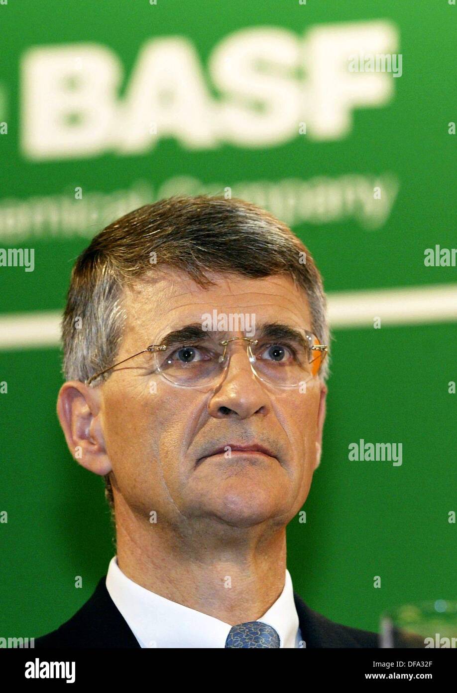 The chief executive of the BASF, Jürgen Hambrecht, is standing in front of the new logo of the company during a press conference in Ludwigshafen on 10 December 2003. Stock Photo