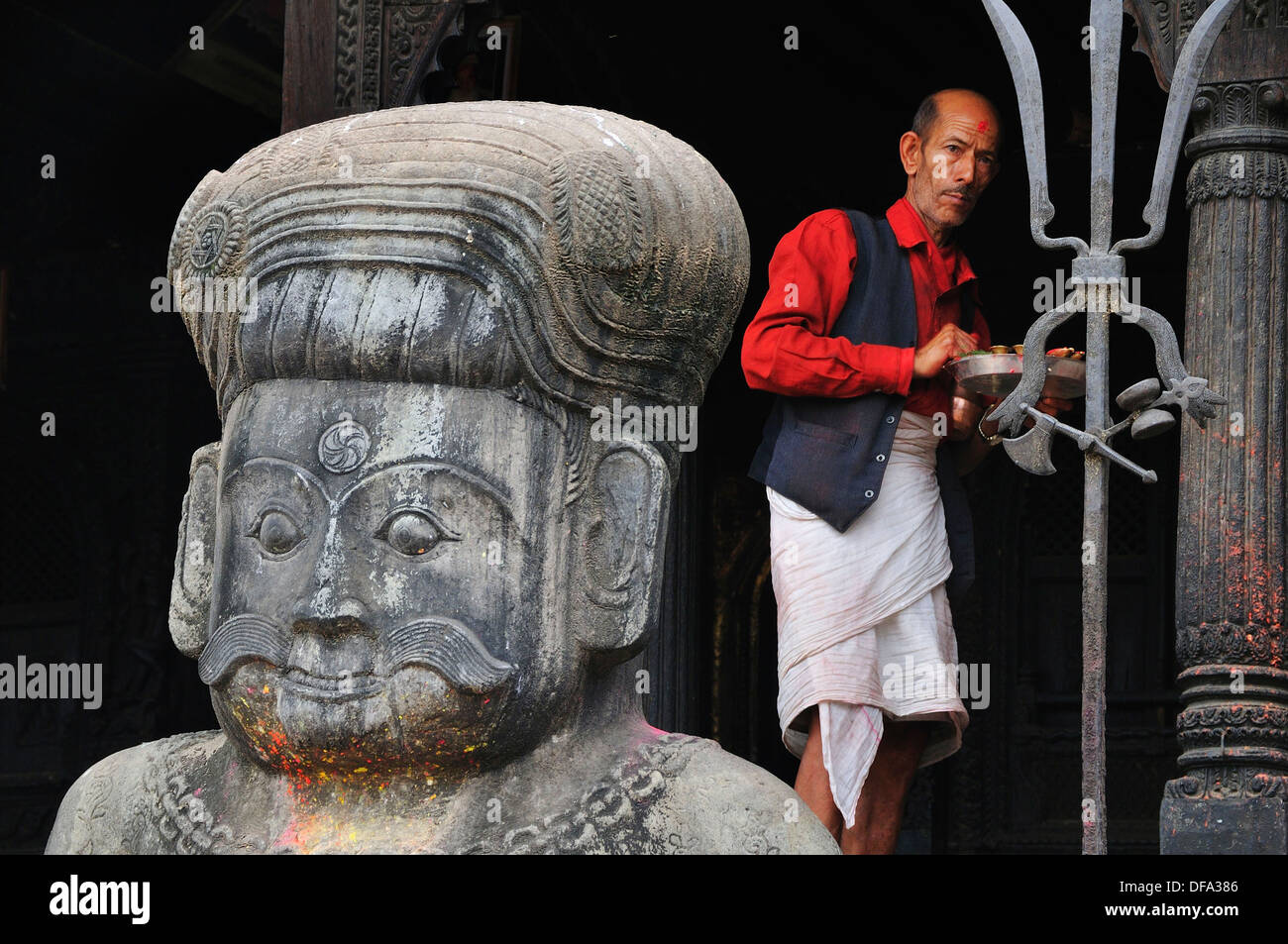 At the entrance of the Dattatraya Temple wrestler stone statue protect