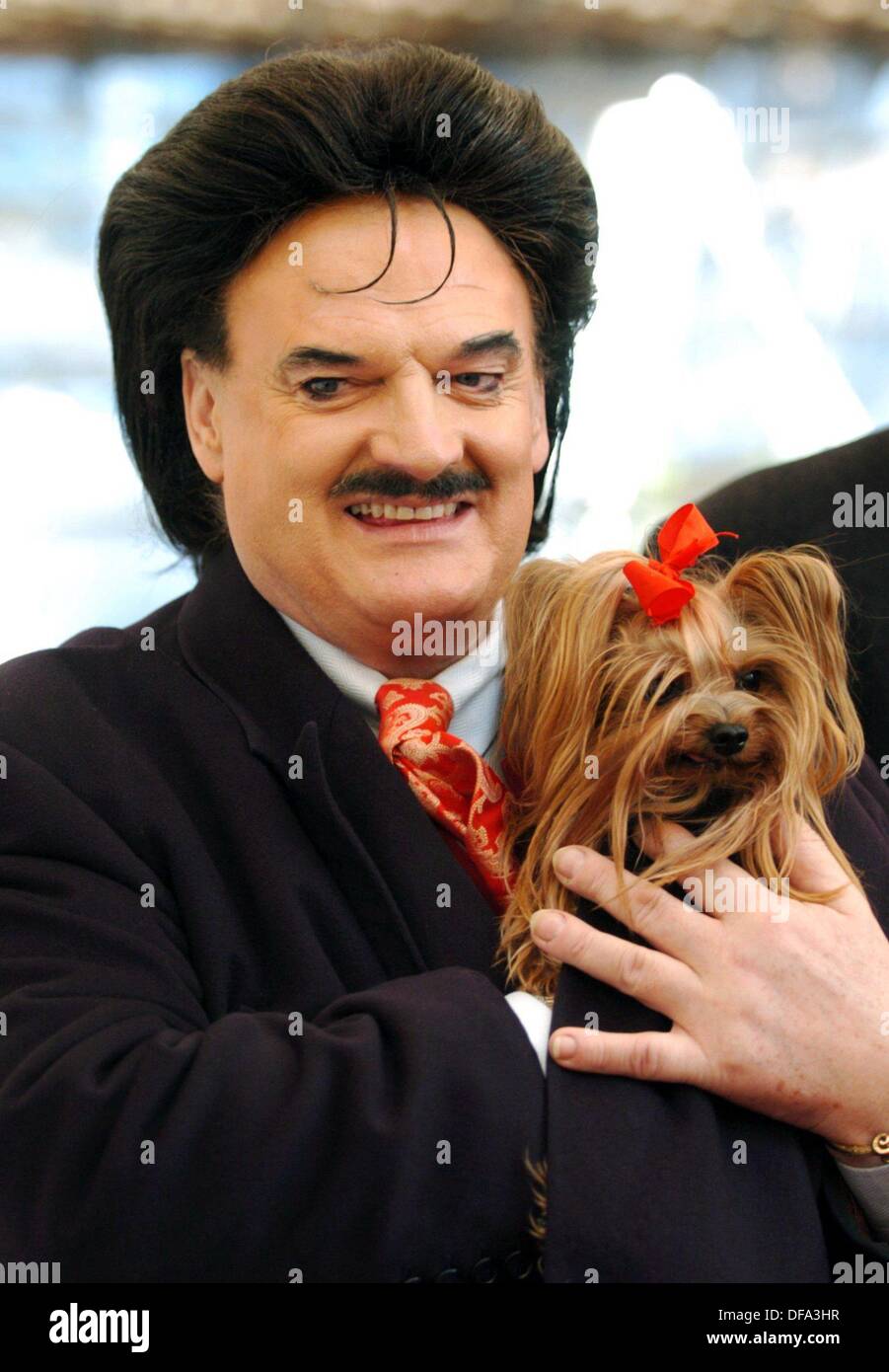 Fashion icon Rudolph Moshammer and his dog Daisy at 'Holiday on Ice' on the 9th of December in 2003. Stock Photo