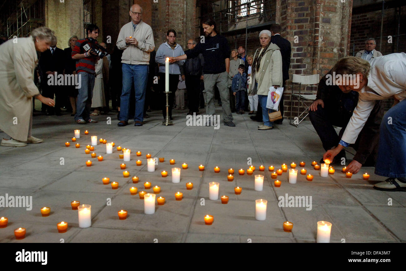 Inhabitants of Frankfurt Oder commemorate the nine killed babies on the 11th of August in 2005. The mother is accused of having killed the babies shortly after the childbirth. Stock Photo