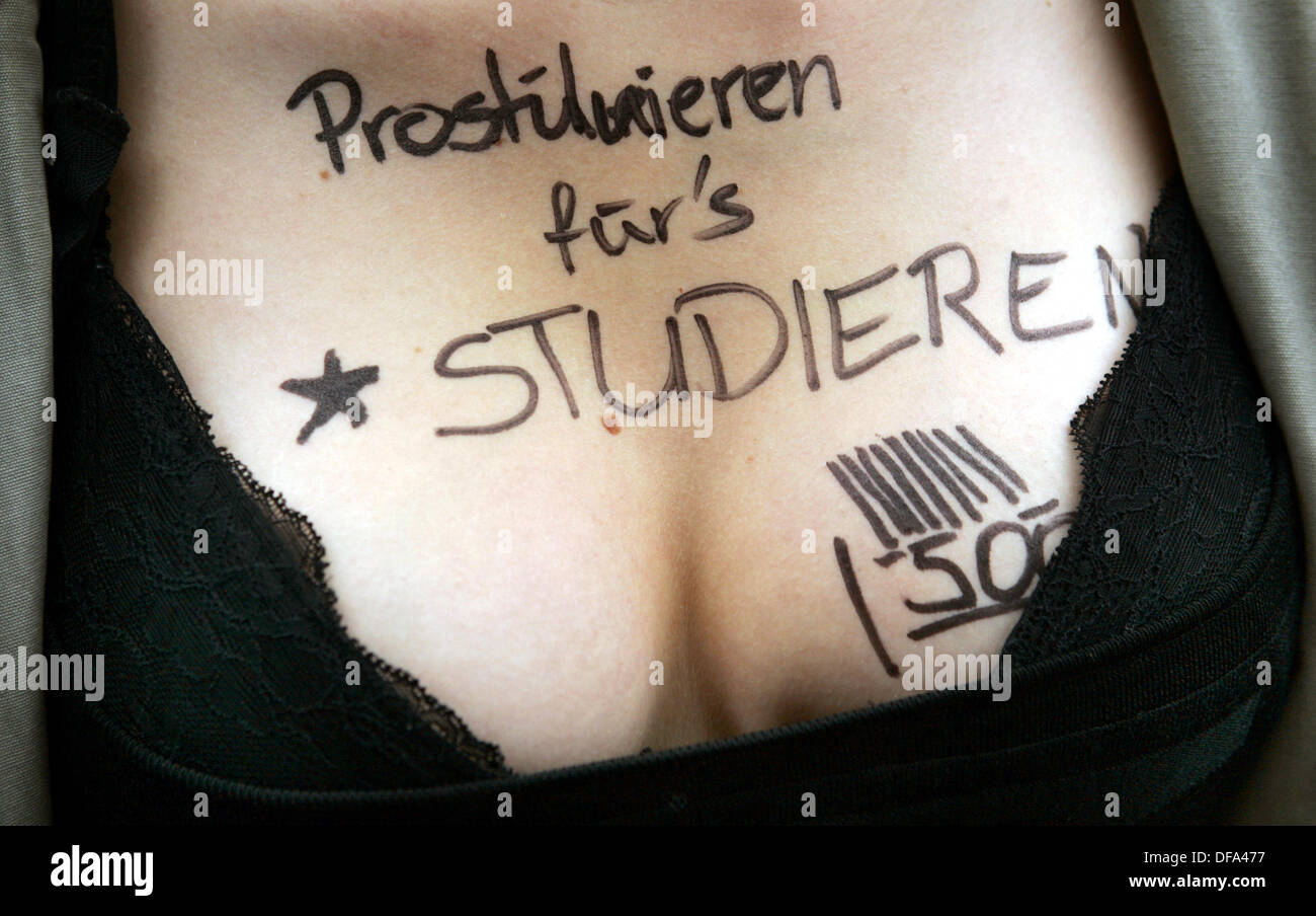 A writing in a female student's cleavage says 'Prostituting to be able to study' during a demonstration on the 31st of May in 2005 against university tuition fees. Stock Photo