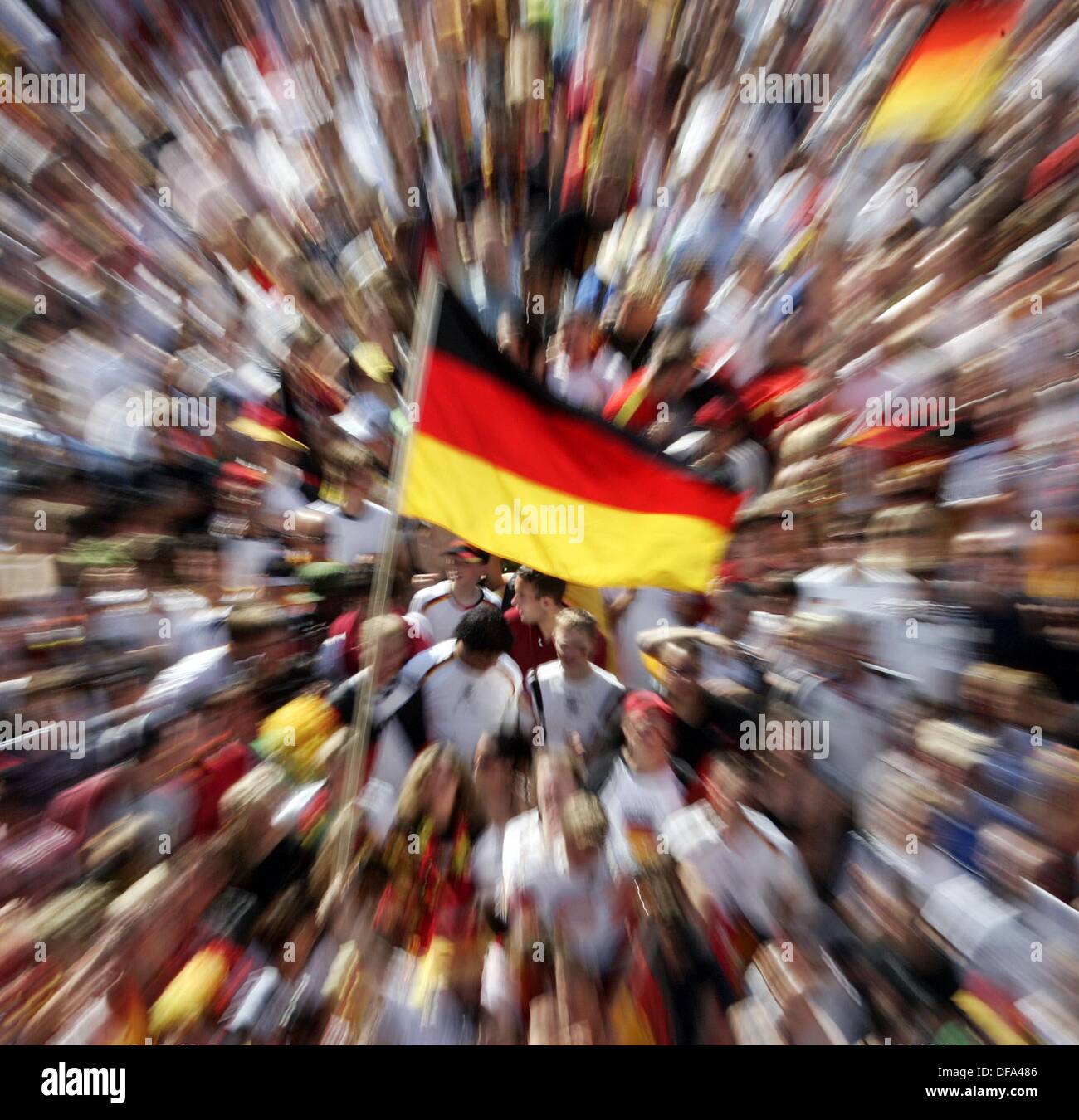 Fans wave a German flag during the match against Argentinia at the Reeperbahn in Hamburg on the 30th of June in 2006. Stock Photo