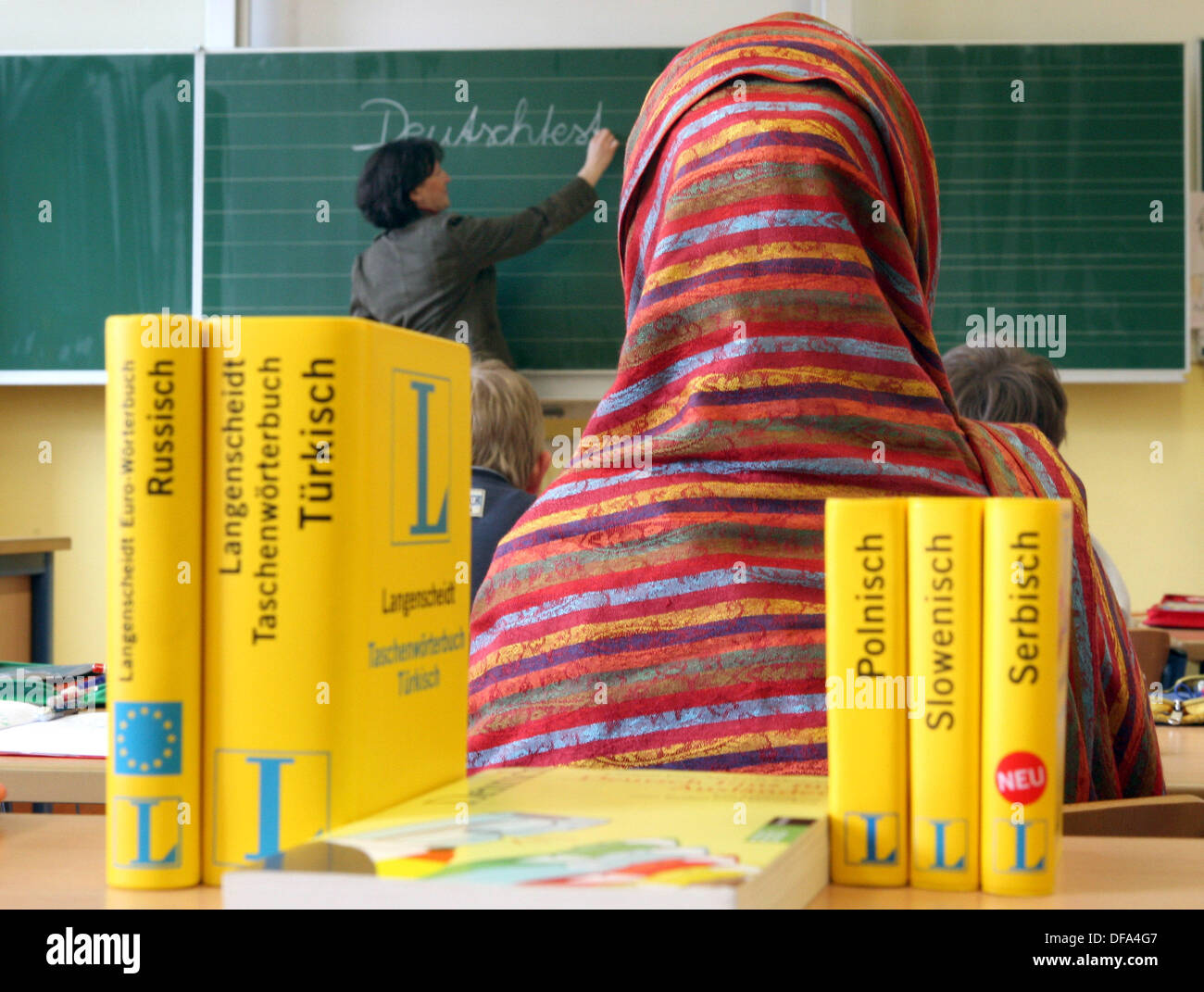 A girl with veil (staged picture) in the class room on the 4th of April in 2006. Stock Photo