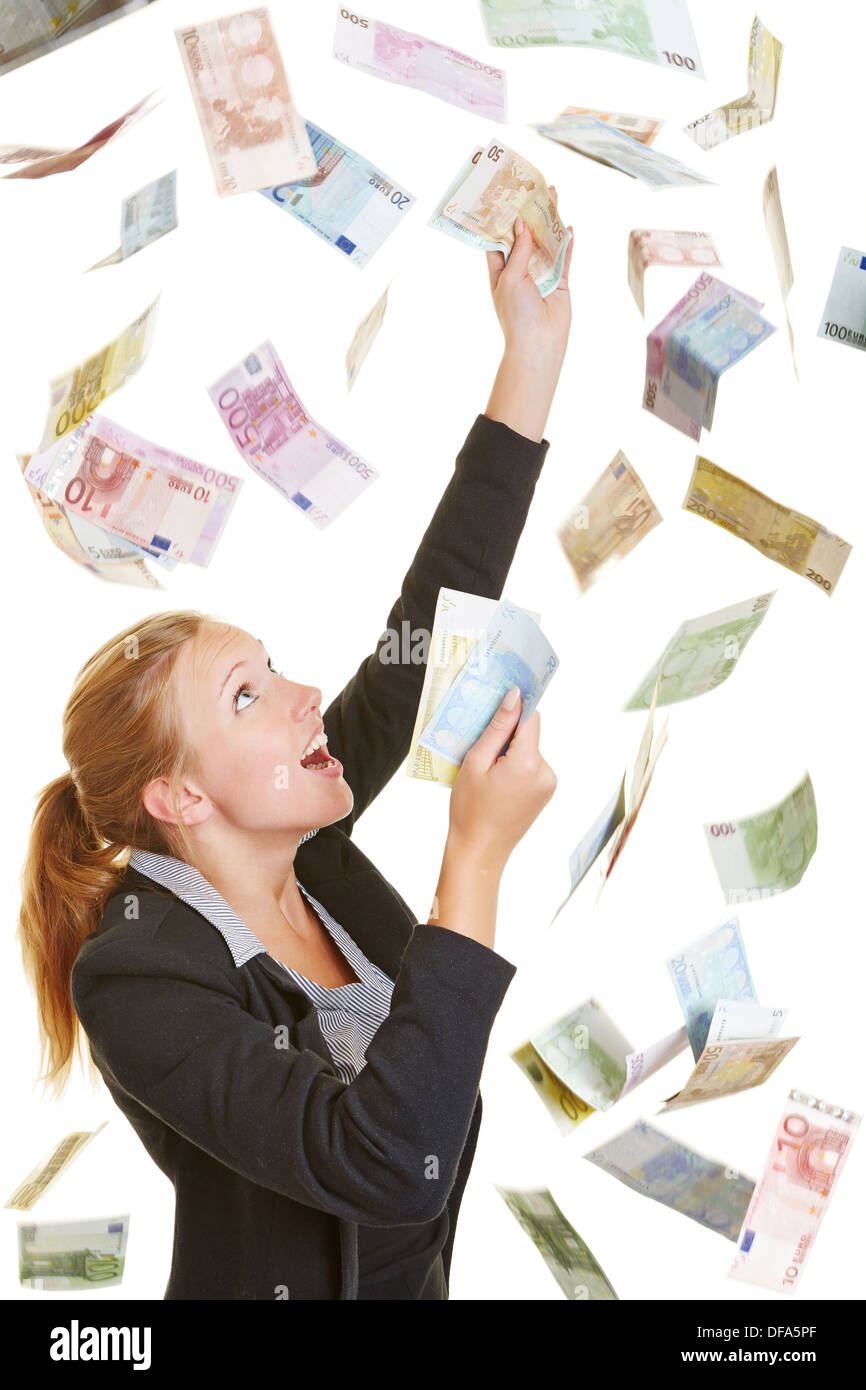 Happy lucky business woman catching flying Euro money banknotes Stock Photo