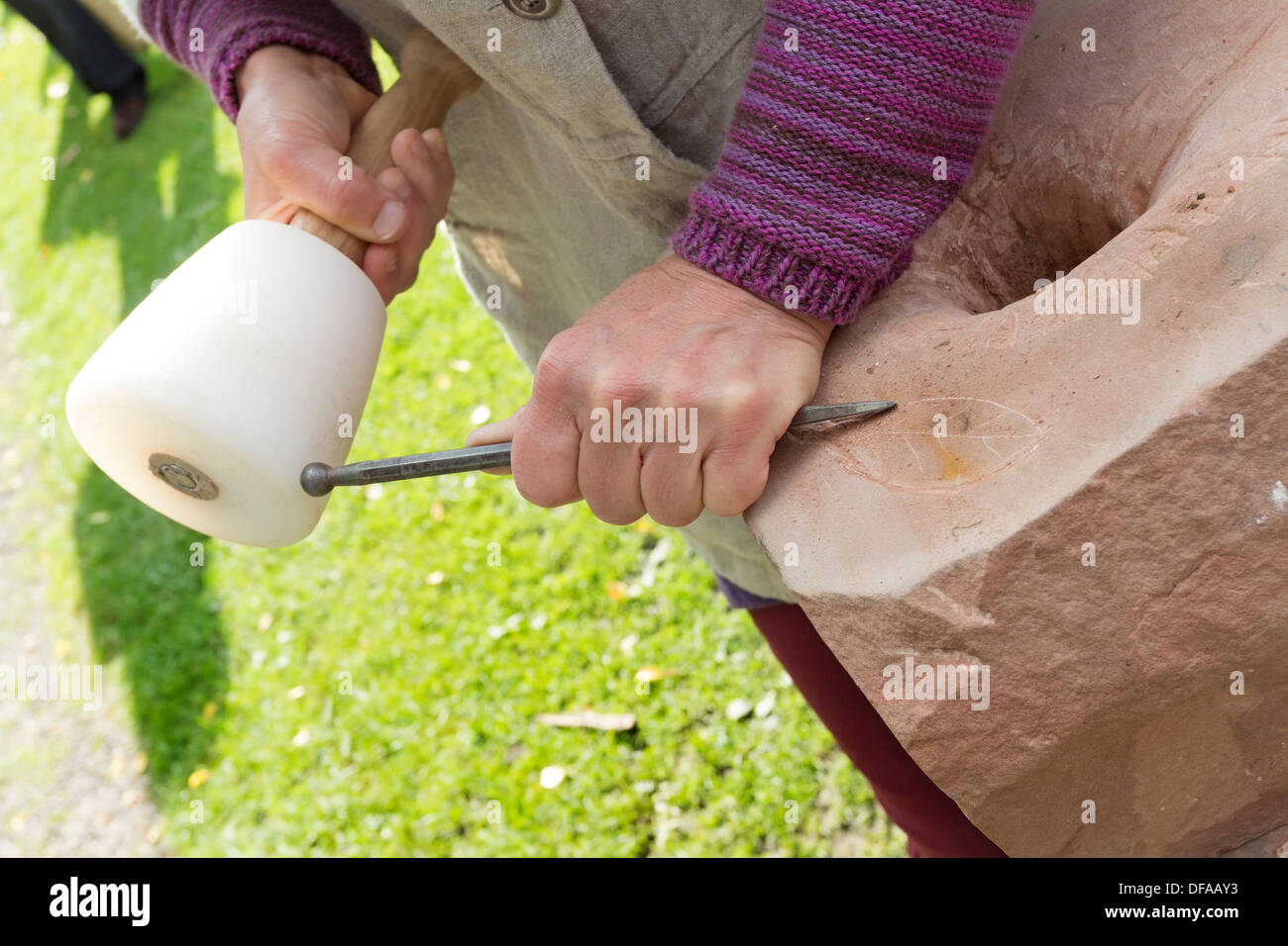 Person Practicing Stone Carving Skills UK Stock Photo