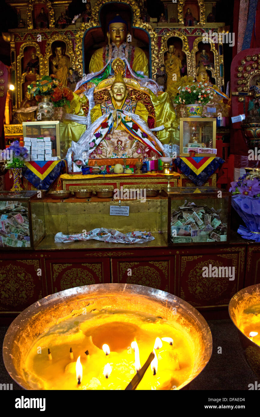 Yak butter lamp candle burning, Golden chapel, Dalai Lama and Buddha statue, in Drepung monastery, Lhasa, Tibet Stock Photo