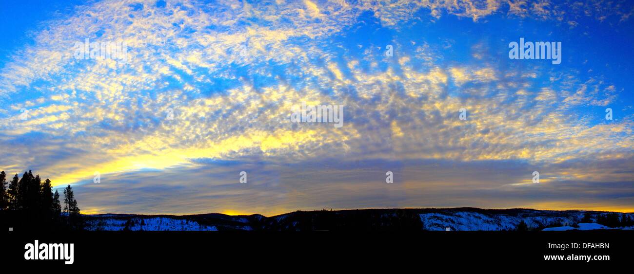 High clouds and irregular shapes highlight the sunset during winter at