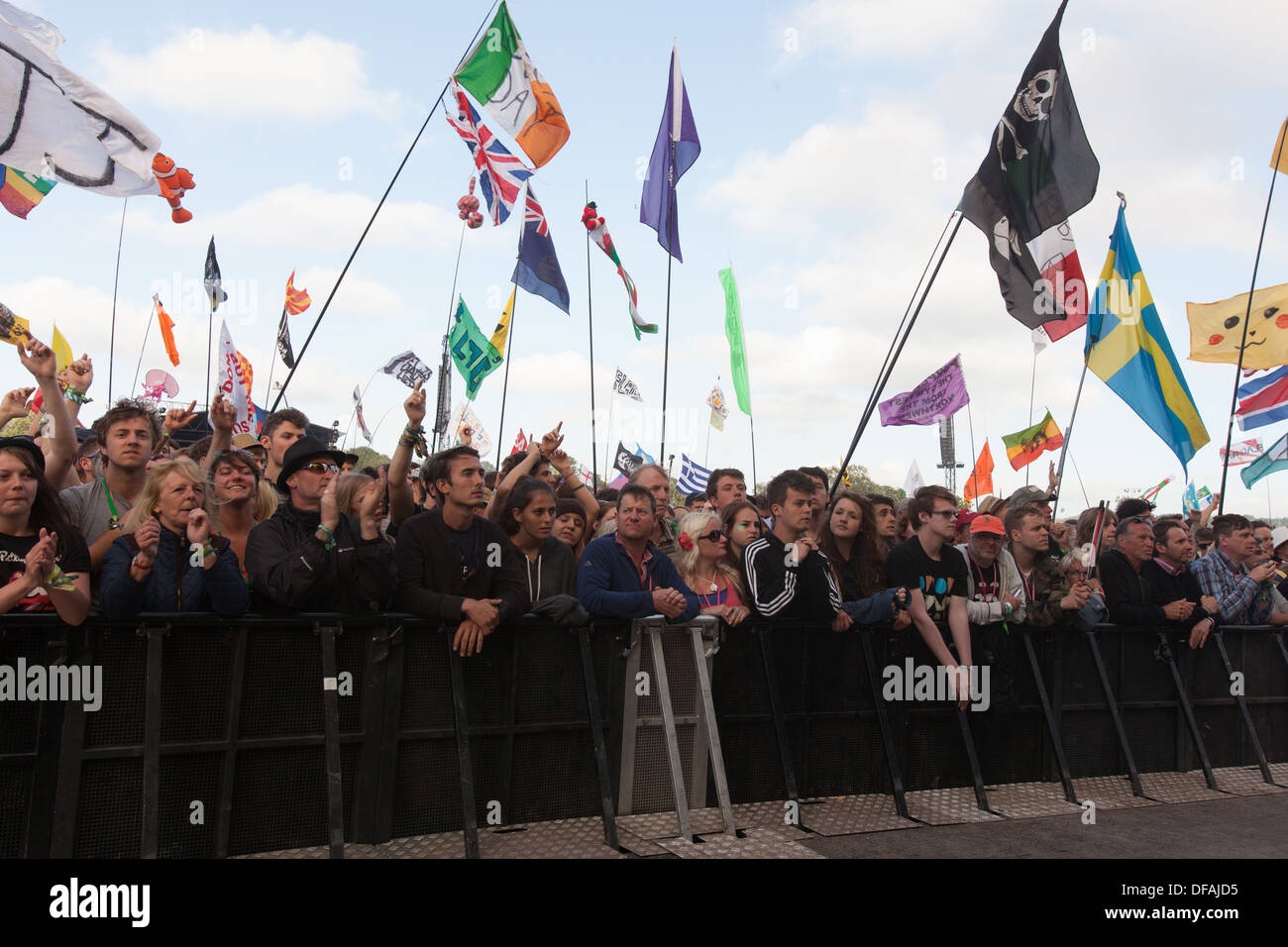 The crowd watching Primal Scream playing the Pyramid stage at the Glastonbury Festival 2013. Stock Photo