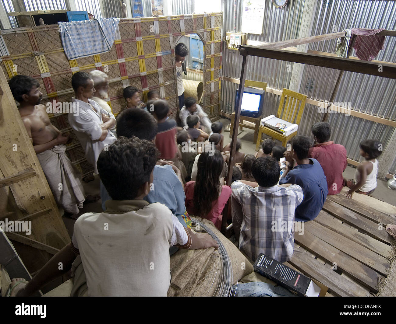 Rural Bangladeshis gather to watch television in village house Stock Photo Alamy