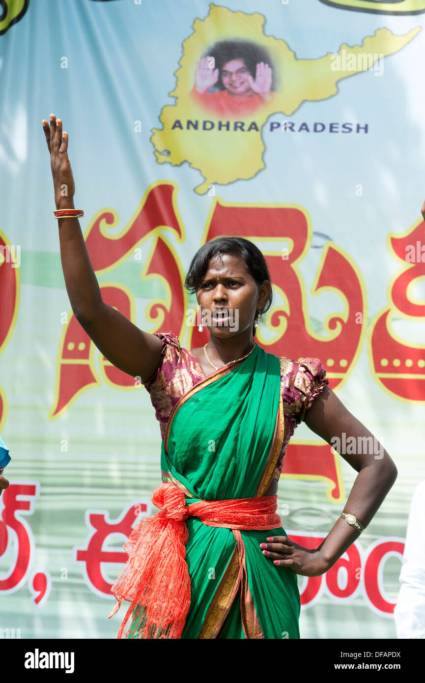 Indian girl dressed in traditional costume dancing at a protest rally. Puttaparthi, Andhra Pradesh, India Stock Photo