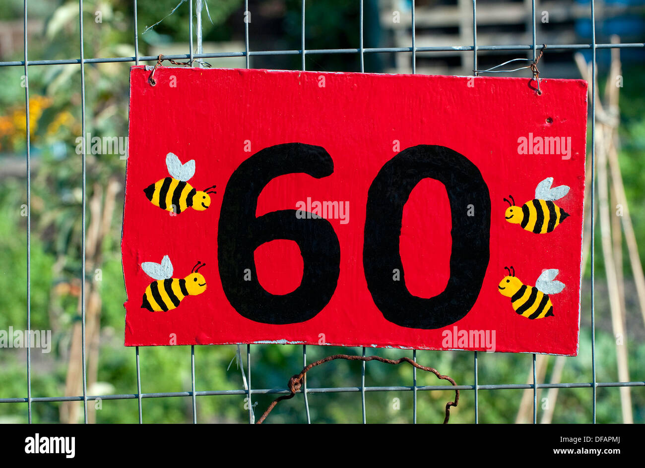 number sixty sign on allotment garden fence Stock Photo