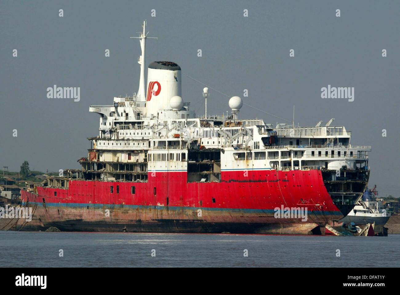 A ship is being dismantled in the worlds largest shipbreaking yard in Alang, India. Stock Photo