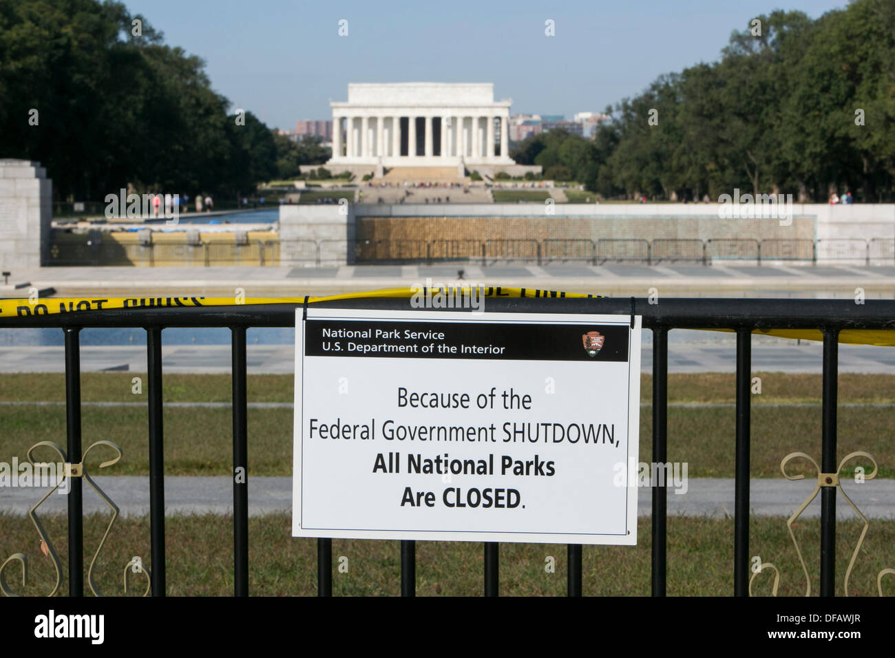 Washington DC, USA. 01st Oct, 2013. The World War Two Memorial is closed and barricaded due to the government shutdown on October 1, 2013 in Washington, DC. The US Federal Government shut down at midnight after Congress was unable to pass a funding bill over a dispute to defund Obamacare. Credit:  Kristoffer Tripplaar/Alamy Live News Stock Photo
