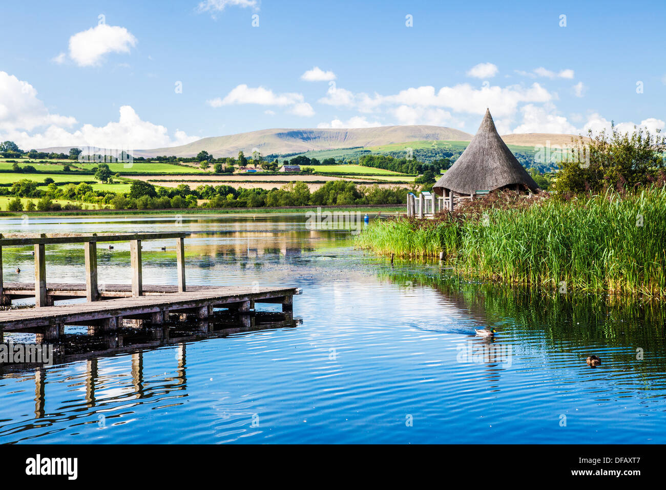 Llangors Lake in the Brecon Beacons National Park, Wales with the crannog on the far right. Stock Photo