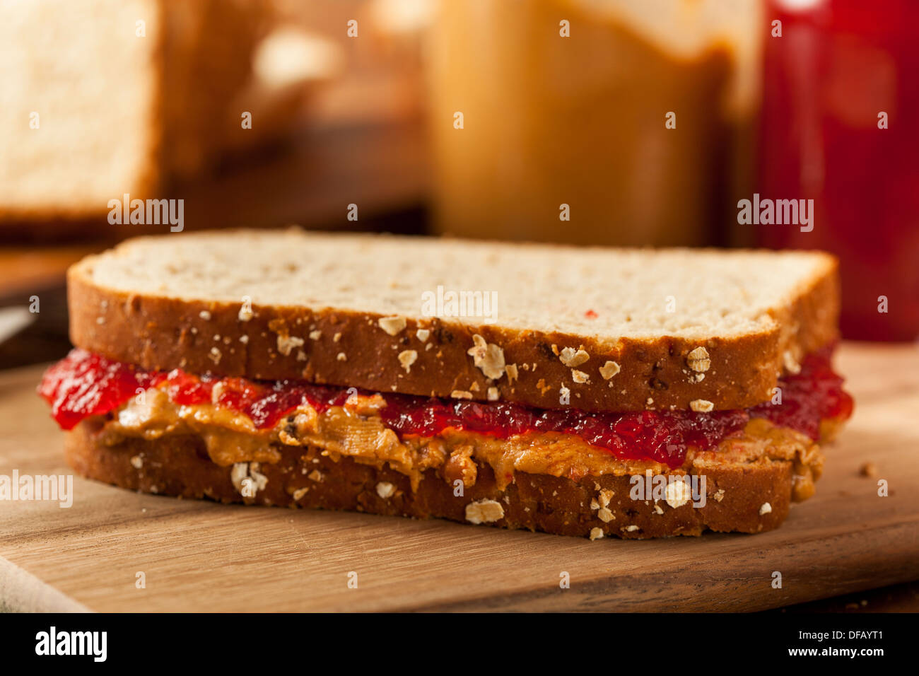 Homemade Peanut Butter and Jelly Sandwich on Whole Wheat Stock Photo