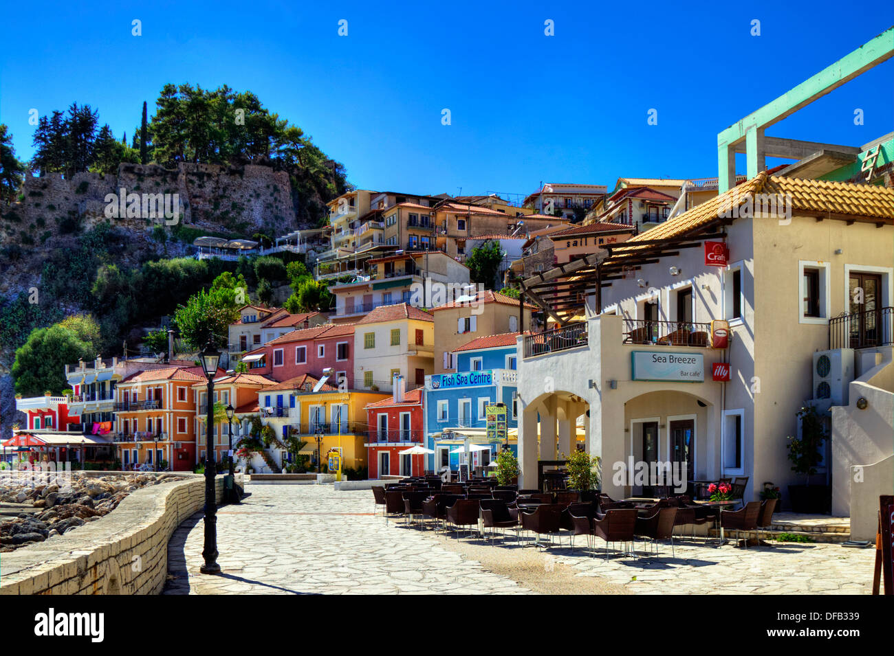 Colourful houses at Parga Town Greece Greek destination castle to right Stock Photo