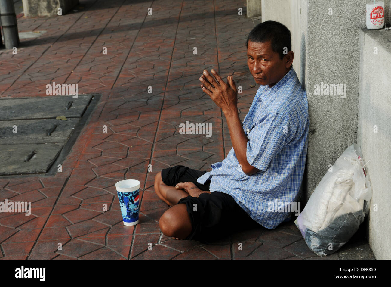 Poor Beggar in Bangkok Stock Photo