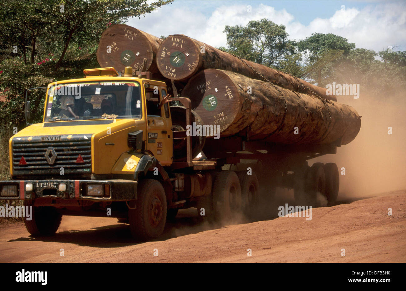 Logging trucks underway to the coast, rainforest, Cameroon. Stock Photo