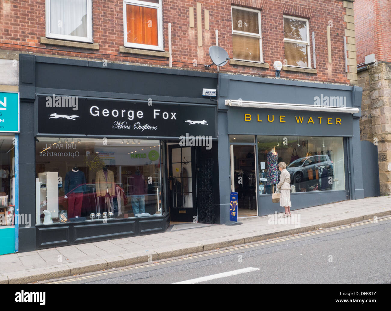 2 Clothing shops on the Belper Town high street in Derbyshire, United Kingdom. Stock Photo