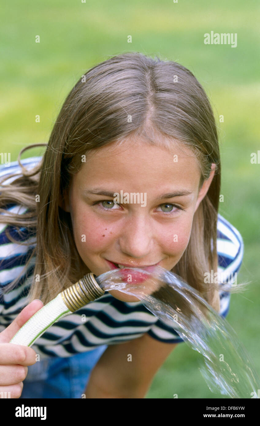 drinking water from hose Stock Photo Alamy