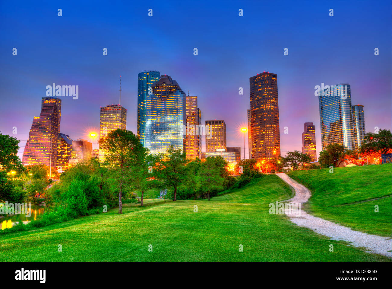Houston Texas modern skyline at sunset twilight from park lawn HDRI