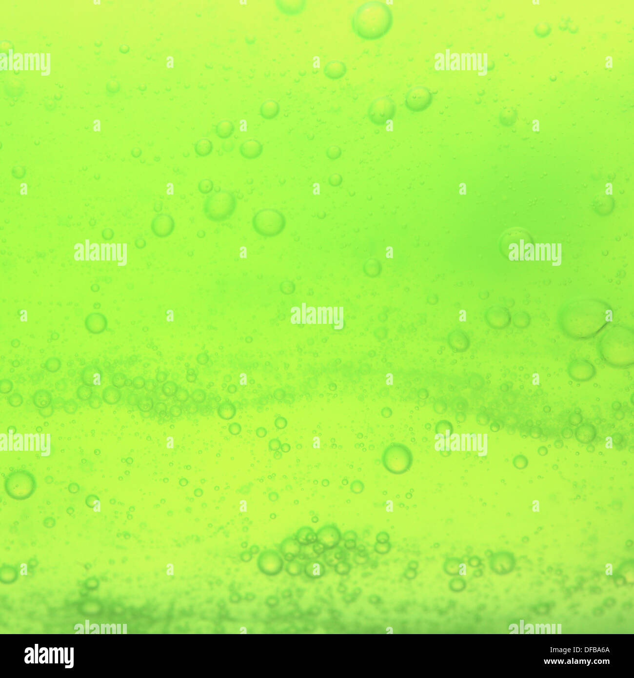 Green abstract blurred liquid background with soap bubbles. Square ...