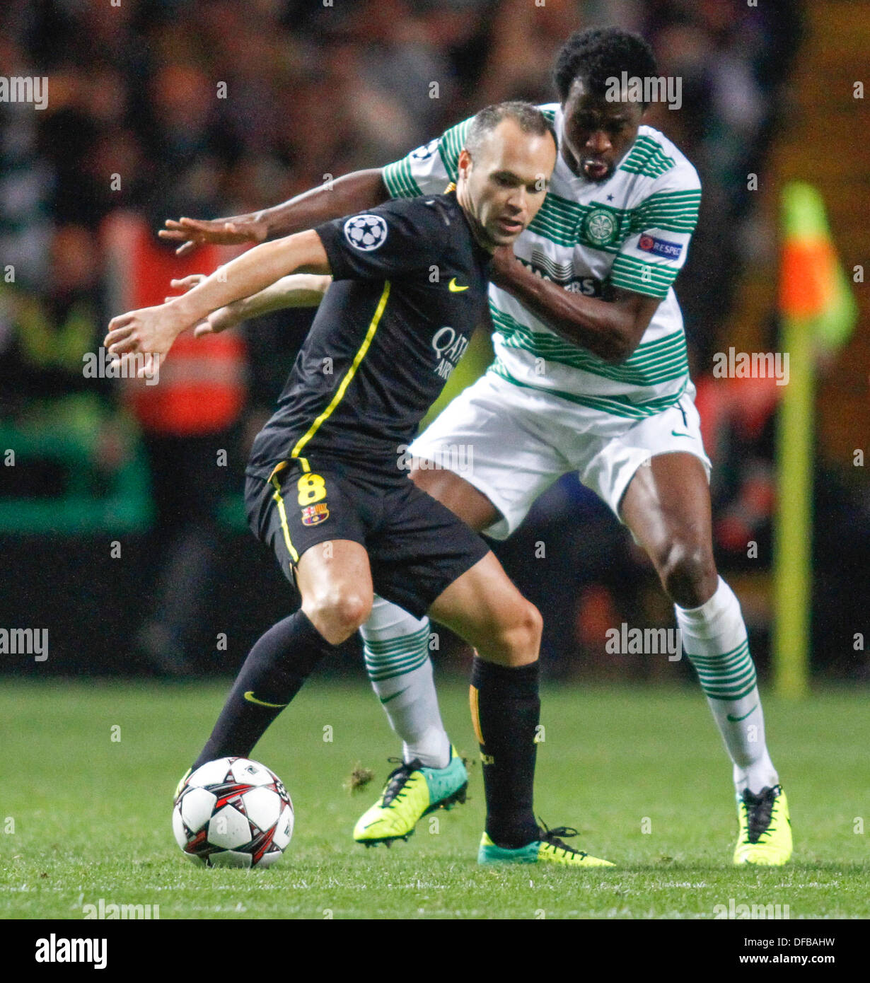Glasgow, Scotland. 01st Oct, 2013. Efe Ambrose gets to grips with Andres Iniesta during the Champions League game between Celtic and Barcelona from Celtic Park. © Action Plus Sports/Alamy Live News Stock Photo